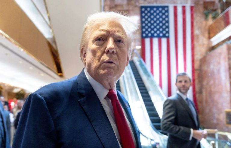 Now, Trump says, the photo of him with E. Jean Carroll may be ‘AI’